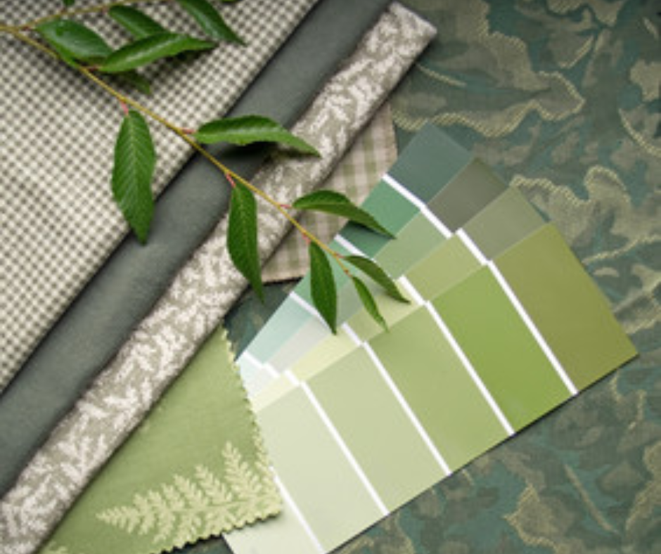 Picture of different shades of green paint chips with coordinating fabrics.